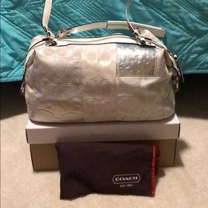 White and silver coach purse